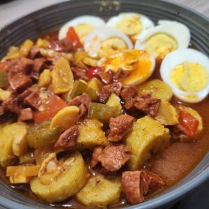 Haitian breakfast boil eggs and sauces hotdog & plantain